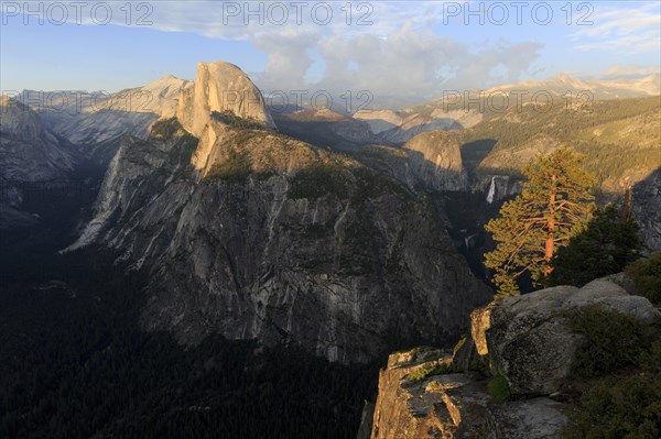 Warm evening light illuminates Half Dome and the surrounding cliffs of Yosemite, Yosemite National Park, North America, USA, South-West, California, California, North America