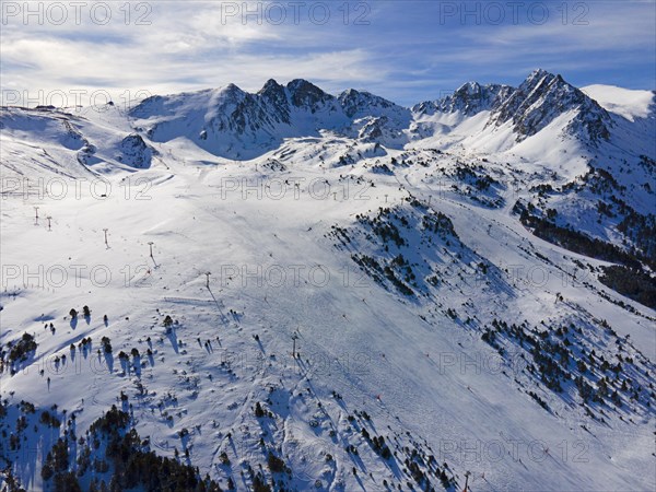 Aerial view of a snow-covered ski resort with mountains in the background, Grau Roig, Encamp, Andorra, Pyrenees, Europe