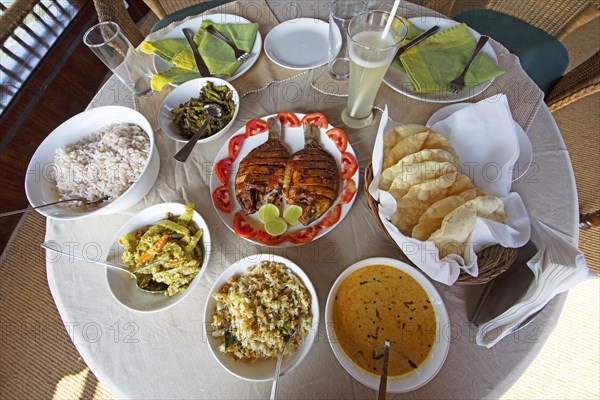 Traditional Kerala dishes, striped cichlid in the centre, Kerala, India, Asia