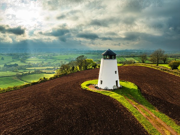 Sunset of Devon Windmill over Fields and Farms from a drone, Torquay, Devon, England, United Kingdom, Europe