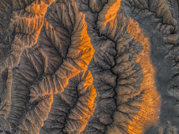 Aerial view, View from above, Canyon runs through landscape, Dramatic barren landscape of eroded hills, Badlands, Canyon of the Forgotten Rivers, Issyk Kul, Kyrgyzstan, Asia