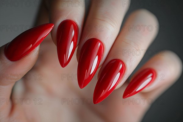 Woman's stiletto style shaped fingernails with red nail polish. KI generiert, generiert, AI generated