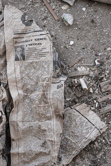 Old newspaper and objects from the USSR, Abandoned ruins, ghost town Enilchek in the Tien Shan Mountains, Ak-Su, Kyrgyzstan, Asia