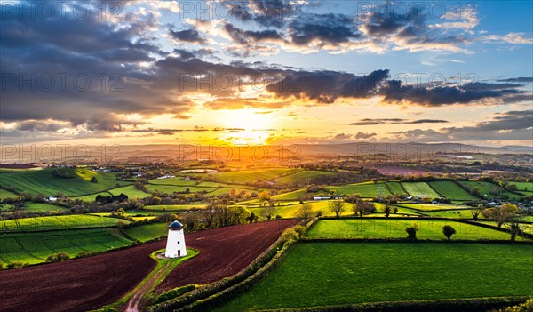 Sunset of Devon Windmill over Fields and Farms from a drone, Torquay, Devon, England, United Kingdom, Europe