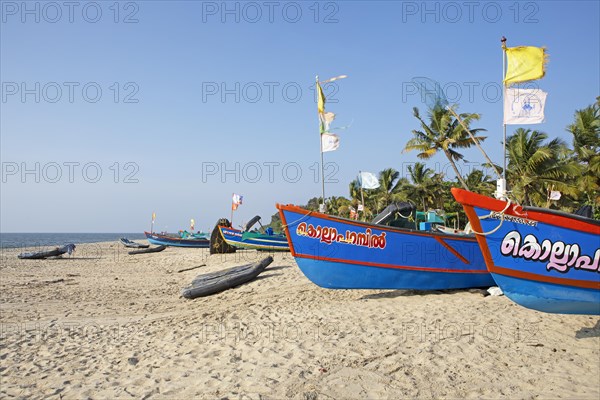Colourful fishing boats on Marari Beach, Mararikulam, Alappuzha district, Kerala, India, Asia