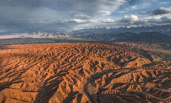 Evening atmosphere, Mountain peaks of the Tien Shan Mountains, Dramatic barren landscape of eroded hills, Badlands, Canyon of the Forgotten Rivers, Issyk Kul, Kyrgyzstan, Asia