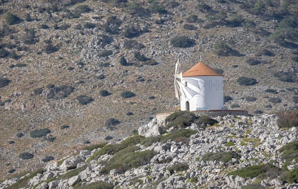 Old windmill on a rock, Beech of Panormitis, Symi, Dodecanese, Greece, Europe