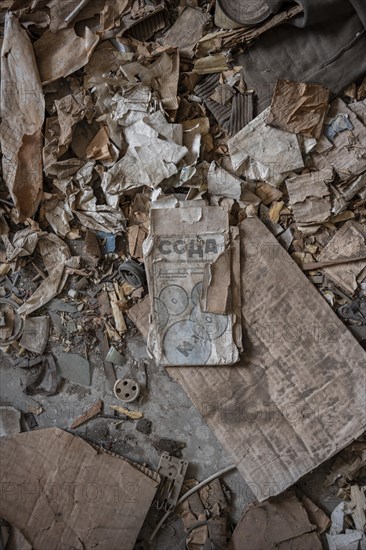 Old newspaper and objects from the USSR, Abandoned ruins, ghost town Enilchek in the Tien Shan Mountains, Ak-Su, Kyrgyzstan, Asia