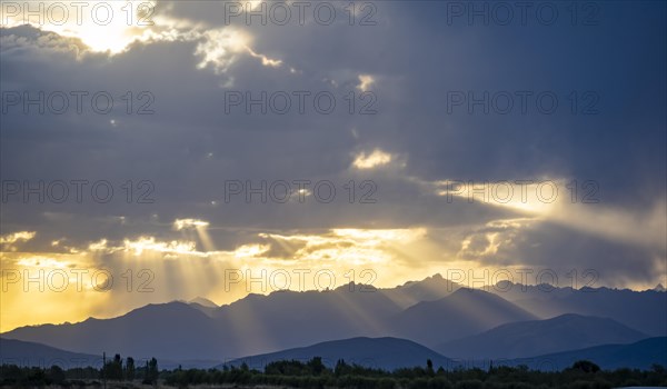 Sunset in front of mountains, Tong, Kyrgyzstan, Asia