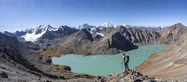 Panorama, mountaineers on the way to the Ala Kul Pass, view of mountains and glaciers and turquoise Ala Kul mountain lake, Tien Shan Mountains, Kyrgyzstan, Asia