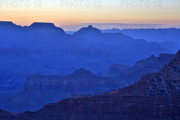 The twilight cloaks the Grand Canyon in a deep blue and emphasises the contours, Grand Canyon National Park, South Rim, North America, USA, South-West, Arizona, North America