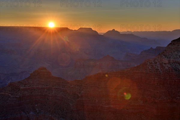 The first rays of the day illuminate the majestic rock faces of the Grand Canyon, Grand Canyon National Park, South Rim, North America, USA, South-West, Arizona, North America