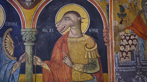 St Christopher with dog's head, church fresco with an animal-shaped figure in religious clothing and surrounded by angels, Panagia Church, St Mary's Church, Lindos village, Rhodes, Dodecanese, Greek Islands, Greece, Europe