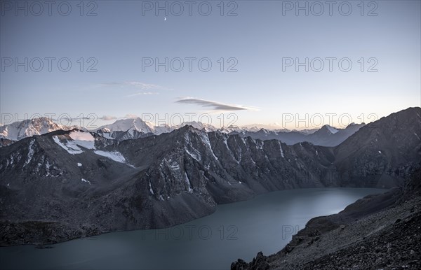 Turquoise mountain lake Ala Kul Lake, mountain peaks with glaciers in the evening, Ala Kul Pass, Tien Shan Mountains, Kyrgyzstan, Asia