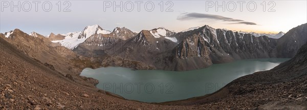 Panorama, Turquoise mountain lake Ala Kul Lake, Mountain peaks with glaciers at dusk, Ala Kul Pass, Tien Shan Mountains, Kyrgyzstan, Asia