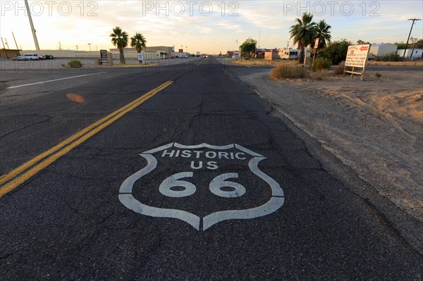 View of historic Route 66 at sunset with road markings and desert landscape, Historic Route 66, Oatman-Topock Highway, North America, USA, South-West, Arizona, North America
