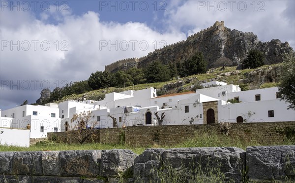 View of the Acropolis and the white houses of Lindos, Rhodes, Dodecanese archipelago, Greek Islands, Greece, Europe