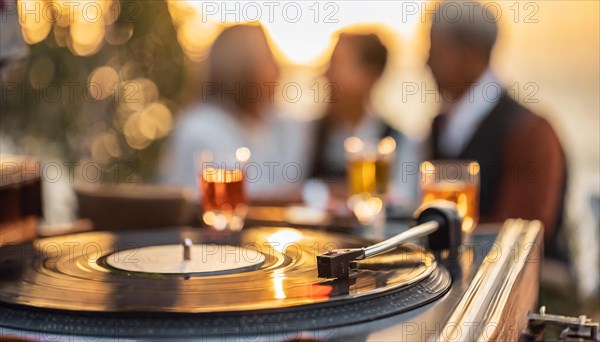 Friends enjoy drinks vinyl record playing together in cozy setting at sunset, bokeh effect ai generated, AI generated