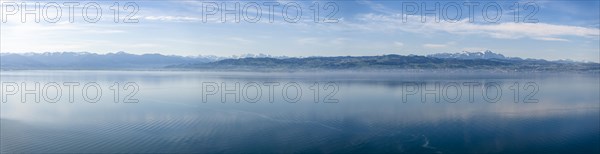 Lake Constance in the early morning, no boats on the lake yet, deserted. In the background the Swiss Alps with the mountain Saentis (2501 metres, right) . Aerial photo, panoramic view, Langenargen, Baden-Wuerttemberg, Germany, Europe