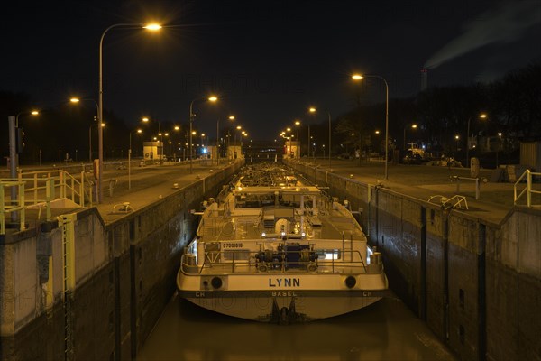 Lock on the Rhine-Herne Canal in Oberhausen-Lirich, at the blue hour, in the evening, ship in the lock chamber, Oberhausen, Ruhr area, North Rhine-Westphalia, Germany, Europe