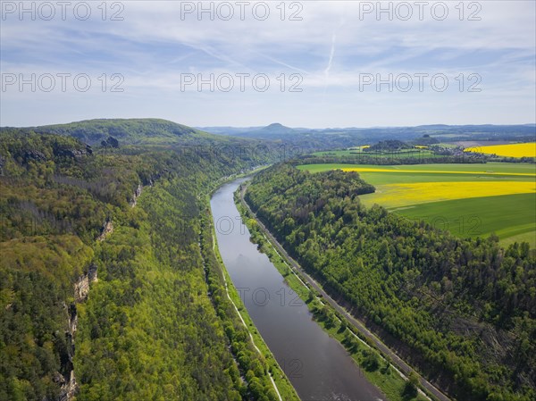 The Schrammsteine are an elongated, heavily jagged group of rocks in the Elbe Sandstone Mountains, located east of Bad Schandau in Saxon Switzerland. View into the Elbe valley upstream to the Grosser Winterberg, the Rosenberg of the Kaiser's crown and the Zirkelstein, Reinhardtsdorf, Saxony, Germany, Europe