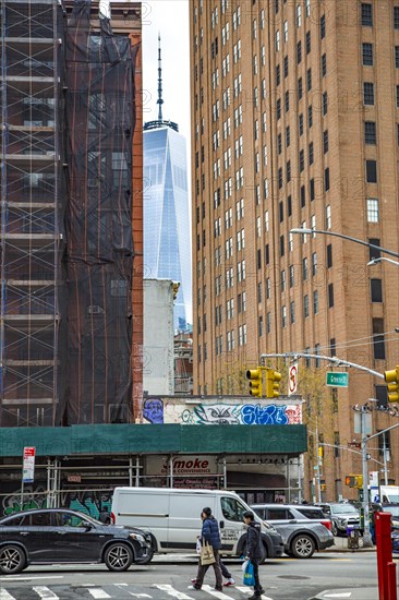The One World Trade Centre can be seen at the end of a street canyon, Lower Manhattan, New York City