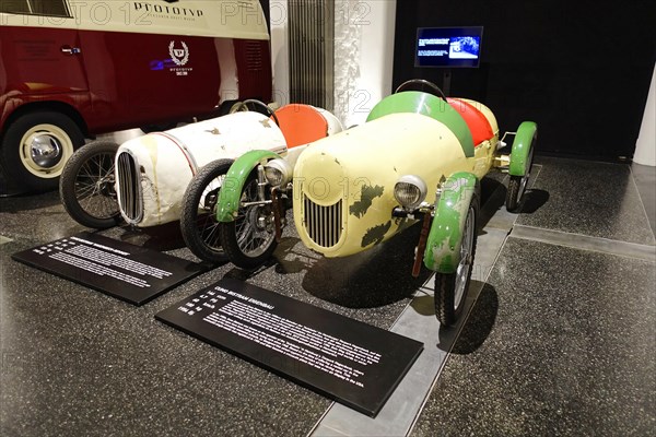 CUNO EIGENBAU, Two vintage racing cars in an exhibition, one in white and one in green, AUTOMUSEUM PROTOTYP, Hamburg, Hanseatic City of Hamburg, Germany Europe