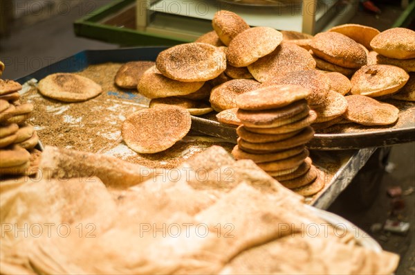 Lebanese man preparing typical sesame and cheese bread, center of Tripoli, northern Lebanon city. Lebanese street cooking