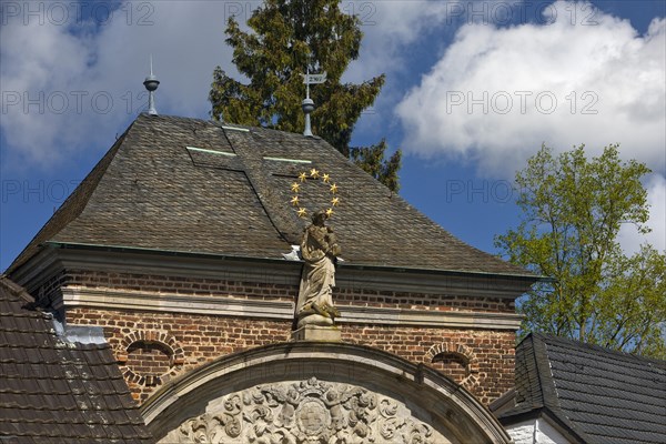 Gatehouse with Madonna figure, Eppinghoven Monastery, former abbey of the Cistercian nuns, Neuss, North Rhine-Westphalia, Germany, Europe