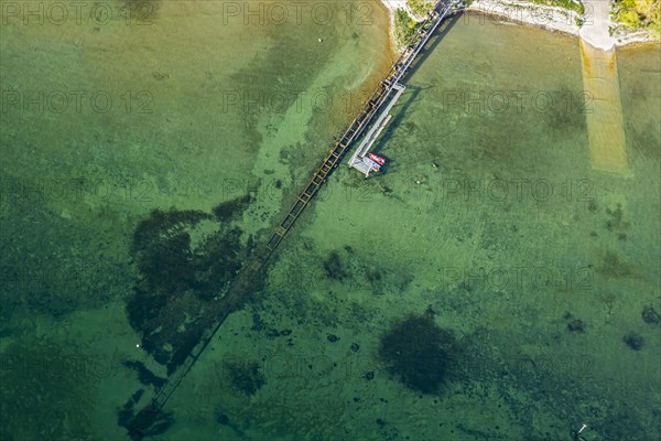 Flight in a zeppelin along the shore of Lake Constance, aerial view, shore area with turquoise water, jetty and sewage pipe, Friedrichshafen, Baden-Wuerttemberg, Germany, Europe