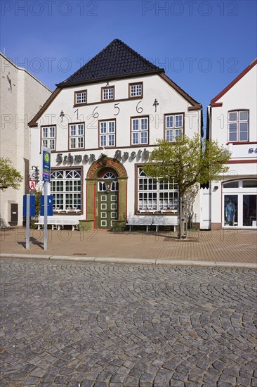 Swan pharmacy in the city centre of Husum, Nordfriesland district, Schleswig-Holstein, Germany, Europe