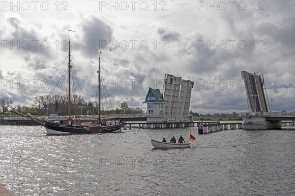 Sailing ship passes through open bascule bridge, Kappeln, Schlei, Schleswig-Holstein, Germany, Europe