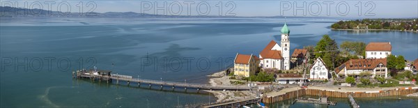 Moated castle peninsula with castle and parish church of St George on Lake Constance. Aerial photo, panoramic view, moated castle, Bavaria, Germany, Europe
