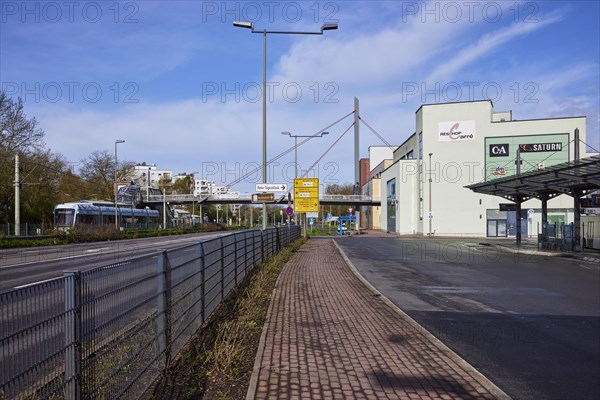 Reschop Carre shopping centre with Martin-Luther-Strasse, bus station, tram, pedestrian bridge and yellow sign in Hattingen, Ennepe-Ruhr-Kreis, North Rhine-Westphalia, Germany, Europe