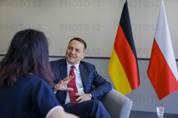 Annalena Baerbock (Alliance 90/The Greens), Federal Foreign Minister, talks to Rados Caw Sikorski, Foreign Minister of Poland, at the Collegium Polonicum in S Cubice. Baerbock visits Slubice on the occasion of the 'AeR20th anniversary of Poland's accession to the EU. S Cubice, 01.05.2024. Photographed on behalf of the Federal Foreign Office
