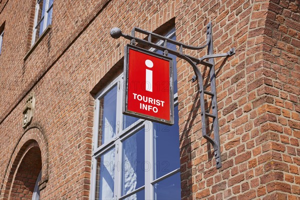 Nose sign tourist information centre at the old town hall in Husum, Nordfriesland district, Schleswig-Holstein, Germany, Europe