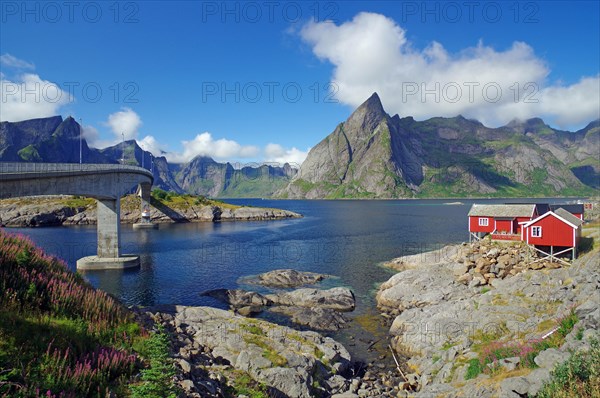 High mountains by a fjord, rorbuer on rocky islands, Hamnoey, Nordland, Norway, Europe