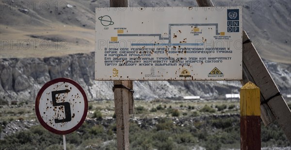 Sign on Russian script, ghost town Enilchek in the Tien Shan Mountains, Ak-Su, Kyrgyzstan, Asia