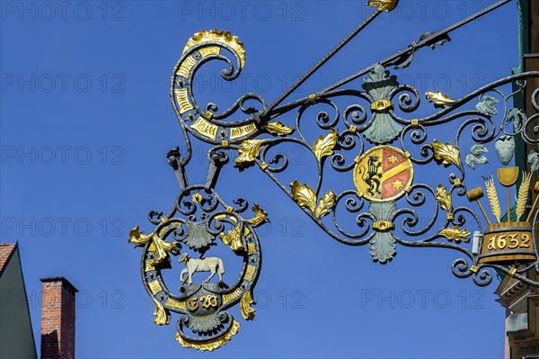 Wrought iron nose shield from 1632 with coat of arms and lamb, Kaufbeuern, Allgaeu, Swabia, Bavaria, Germany, Europe