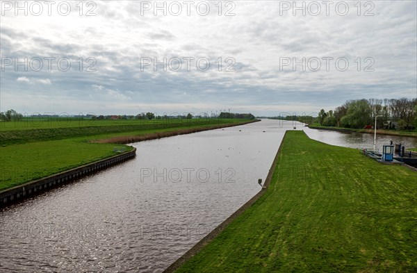 View from the Nieuwe Statenzijl lock of the Westerwolder Aa and Reiderwolder polder (from right), municipality of Oldambt, Dollart, Dollard, province of Groningen, Netherlands