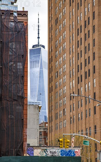 The One World Trade Centre can be seen at the end of a street canyon, Lower Manhattan, New York City