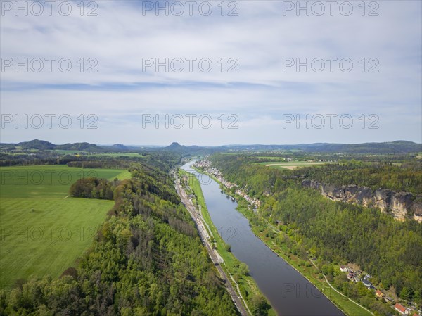 The Schrammsteine are an elongated, heavily jagged group of rocks in the Elbe Sandstone Mountains, located east of Bad Schandau in Saxon Switzerland. View of the Elbe valley downstream towards Bad Schadau and the Lilienstein, Reinhardtsdorf, Saxony, Germany, Europe