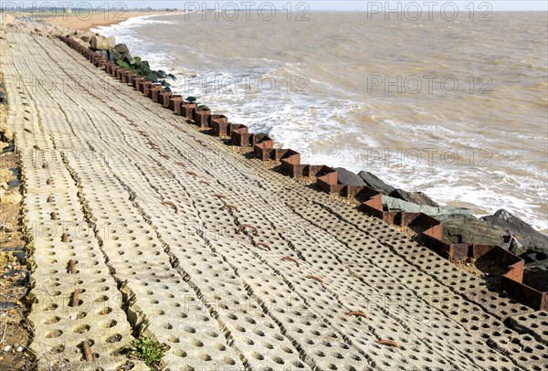 Coastal defences North Sea coast at East Lane, Bawdsey, Suffolk, England, UK sheet piling inclined stone surface drainage holes