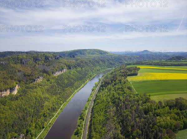 The Schrammsteine are an elongated, heavily jagged group of rocks in the Elbe Sandstone Mountains, located east of Bad Schandau in Saxon Switzerland. View of the Elbe valley upstream to the Grosser Winterberg, the Rosenberg and the Kaiser's crown, Reinhardtsdorf, Saxony, Germany, Europe