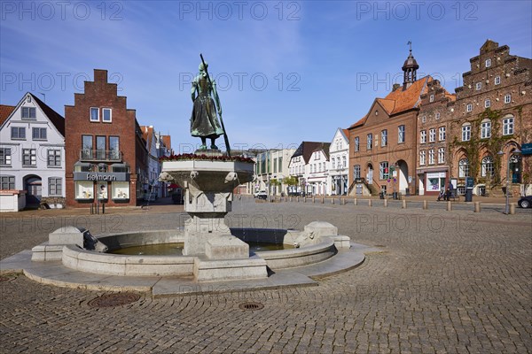 Market square with the back of the Asmussen-Woldsen monument and view towards Grossstrasse in Husum, Nordfriesland district, Schleswig-Holstein, Germany, Europe