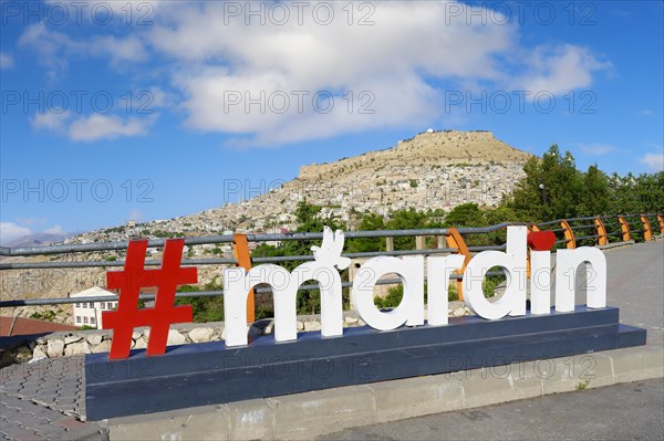 Mardin signpost and the Old city, Mardin, Turkey, Asia