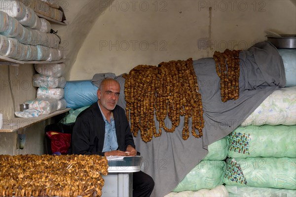 Man selling dried figs, Mardin bazaar, Turkey, Asia
