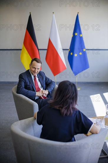 Annalena Baerbock (Alliance 90/The Greens), Federal Foreign Minister, talks to Rados Caw Sikorski, Foreign Minister of Poland, at the Collegium Polonicum in S Cubice. Baerbock visits Slubice on the occasion of the 'AeR20th anniversary of Poland's accession to the EU. S Cubice, 01.05.2024. Photographed on behalf of the Federal Foreign Office