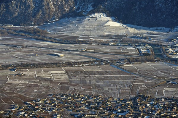The municipality of Riddes in the Rhone Valley surrounded by vineyards in winter, Riddes, Valais, Switzerland, Europe