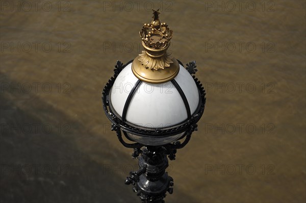 Detail of a lantern with crown on Queen's Walk on the Thames, London, England, Great Britain